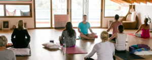 Yogi Aaron teaching a group of yoga students