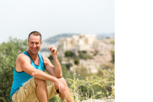 Yogi Aaron sitting in nature happy