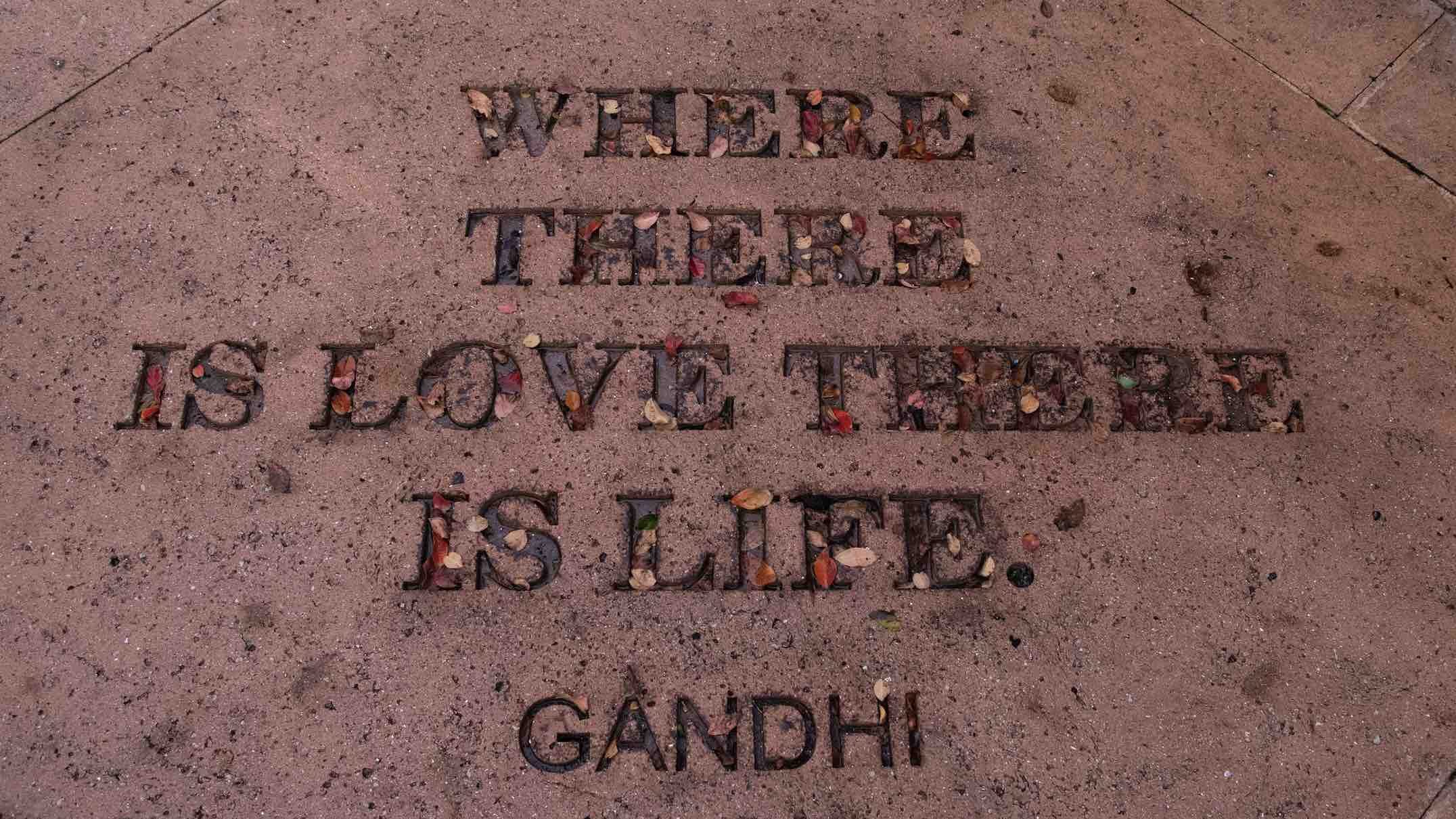 Gandhi quote on a sidewalk "where there is love there is life."