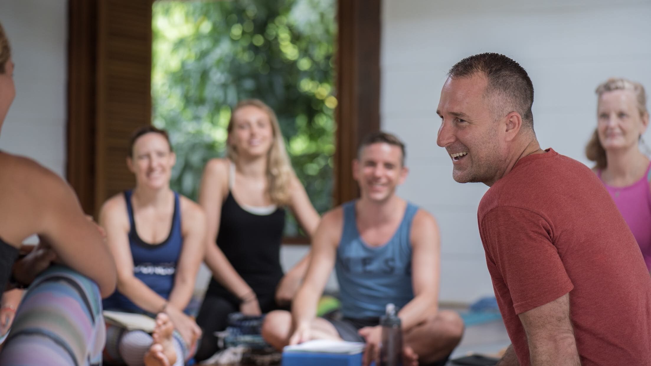 Yogi Aaron Sitting and Teaching with Group of Students