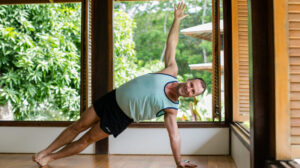 Yogi Aaron Doing One Arm Stand Yoga Pose