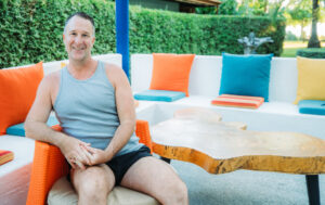 Yogi Aaron Sitting at Blue Osa Yoga Retreat Pool Deck