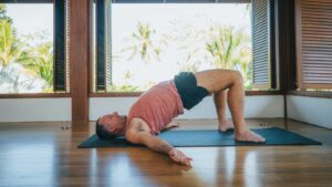 Yogi Aaron Practicing Bridge Yoga Pose in the Yoga Shala at Blue Osa Yoga Retreat