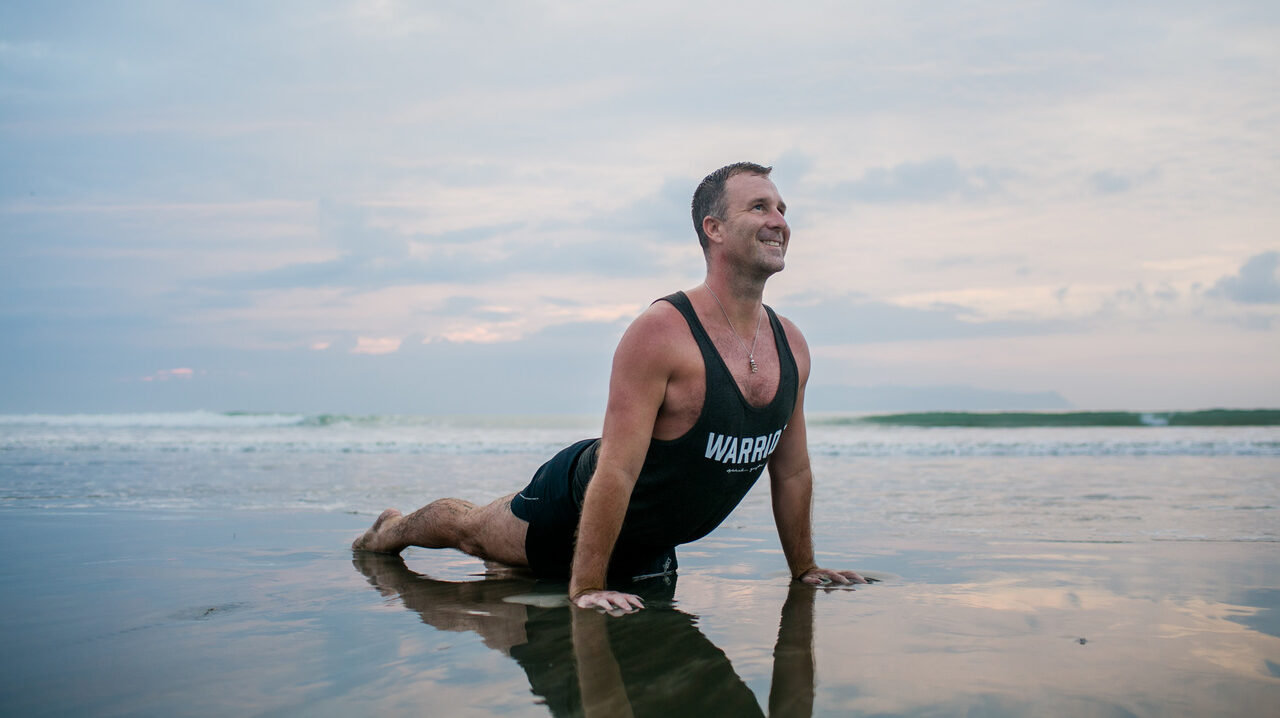 Yogi Aaron In Updog Yoga Pose on the Beach