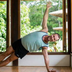 Yogi Aaron Doing One Arm Stand Yoga Pose