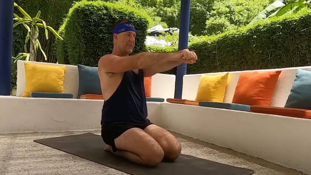 Yogi Aaron demonstrating an AYAMA technique to activate the pectoral muscles