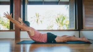 Yogi Aaron Doing Shalabhasana Back Bend Yoga Pose
