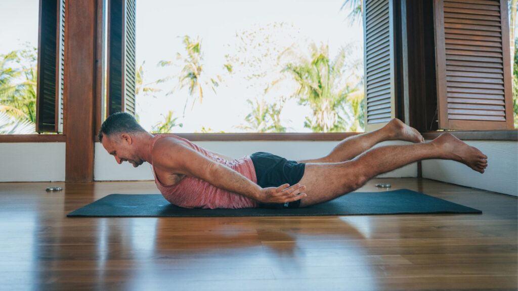 Yogi Aaron doing Shalabhasana "Superman" pose in the Blue Osa Yoga Retreat & Spa Yoga Shala.