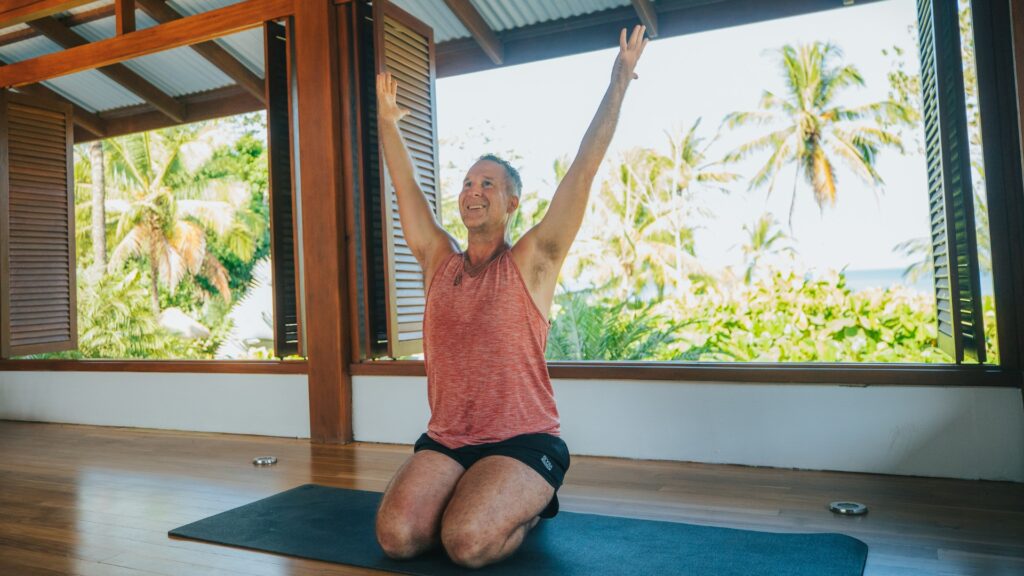 Yogi Aaron doing a shoulder muscle activation technique