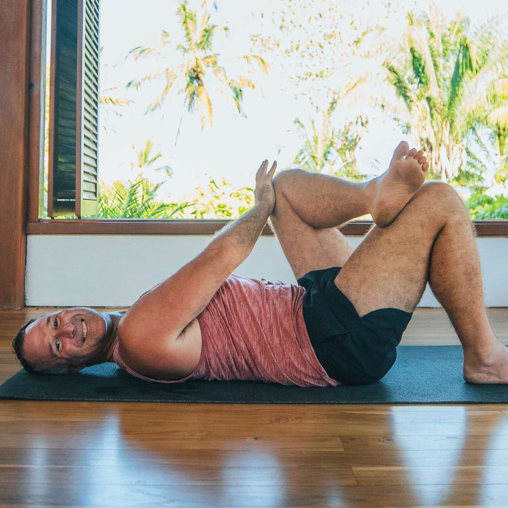 Yogi Aaron doing AYAMA technique to activate the psoas muscle in the yoga shala at Blue Osa Yoga Retreat