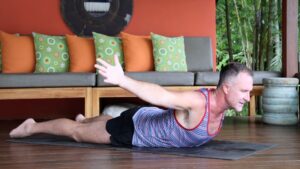 Yogi Aaron doing Superman Yoga Pose Backbend at the Poolside deck at Blue Osa Yoga Retreat and Spa in Costa Rica