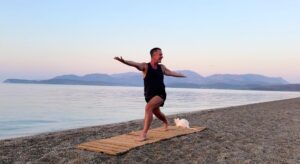 yoga for energy with yogi aaron greece beach 12 twisting high lunge pose