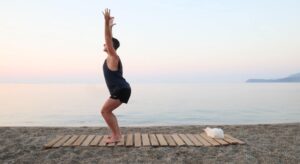 yoga for energy with yogi aaron greece beach chair pose