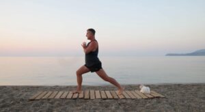 yoga for energy with yogi aaron greece beach 4 high lunge pose