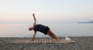 yoga for energy with yogi aaron greece beach 7 side plank pose