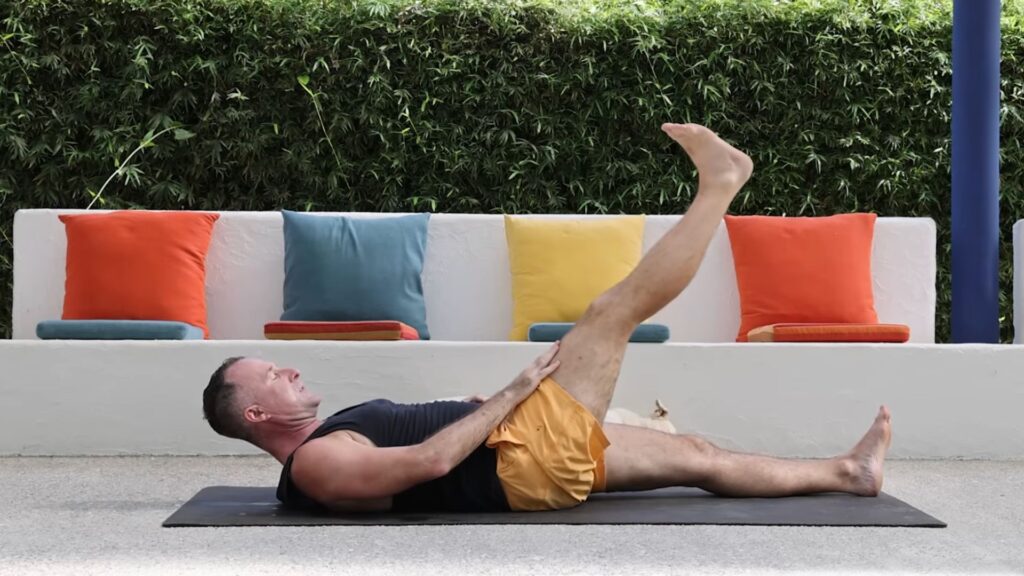 Yoga to stay young with Yogi Aaron leg raise with chest lift pose