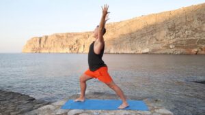 Yogi Aaron doing Warrior 1 Yoga Pose