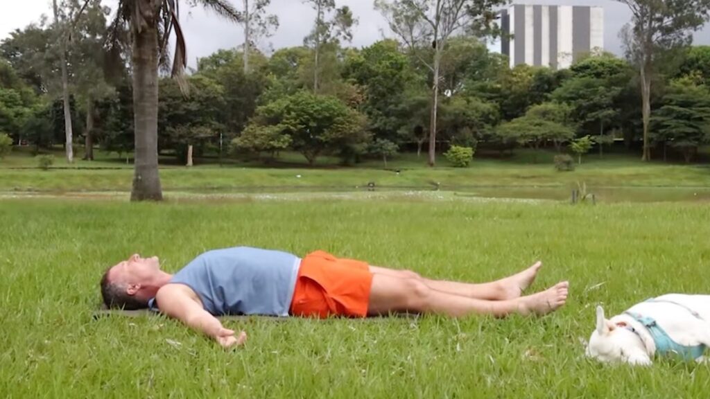 Yogi Aaron, Creator of the AYAMA Method, demonstrating Savasana for Parkinson's Disease