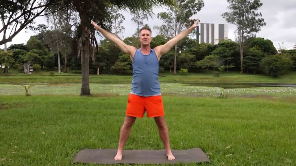 Yogi Aaron demonstrating Tadasana with Arms Overhead using the AYAMA Method