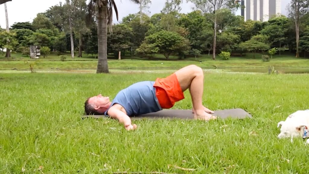 Glute Activation in Bridge Pose demonstrated by Yogi Aaron.