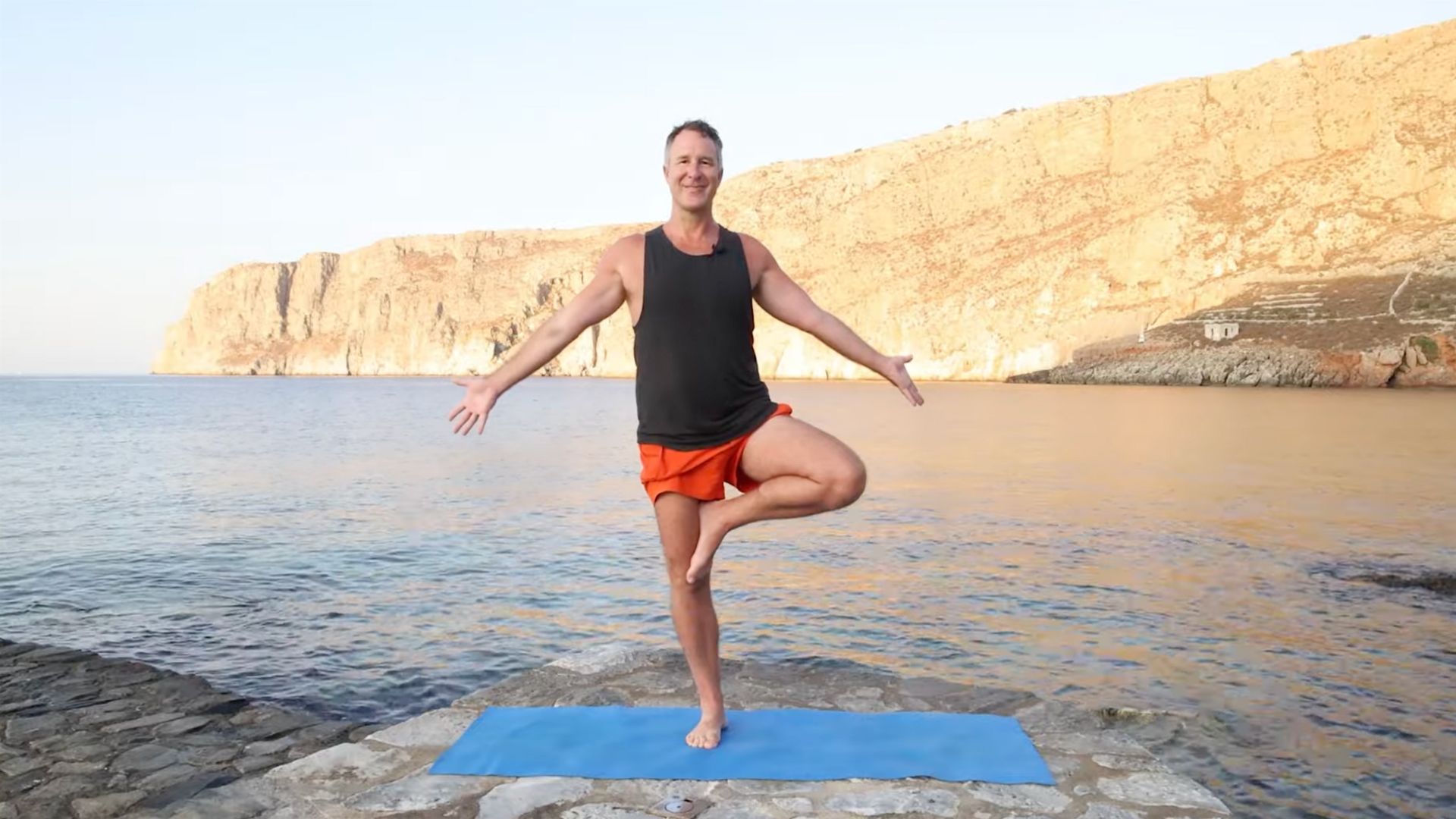 Yogi Aaron Doing Tree Pose in Greece