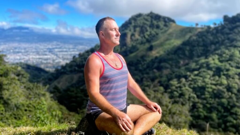 Yogi Aaron meditating outside