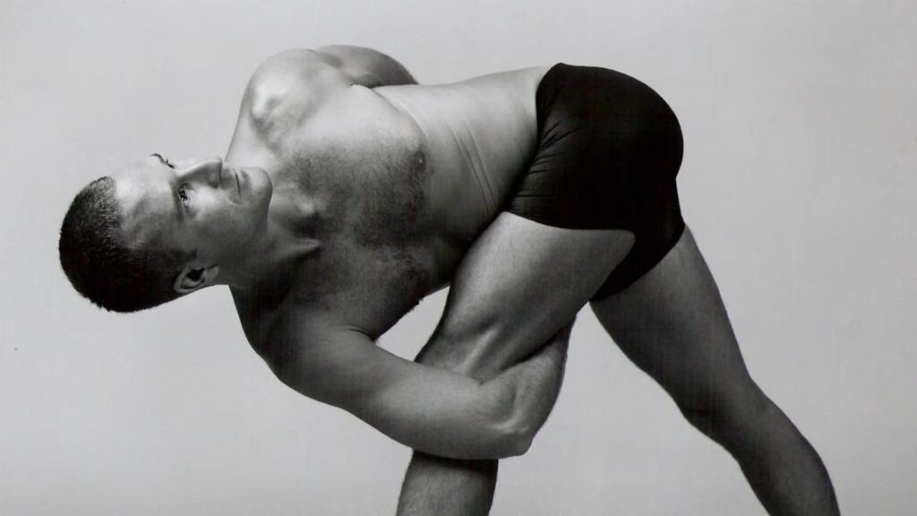 Yogi Aaron practicing Twisting Triangle Pose in Black & White Photography